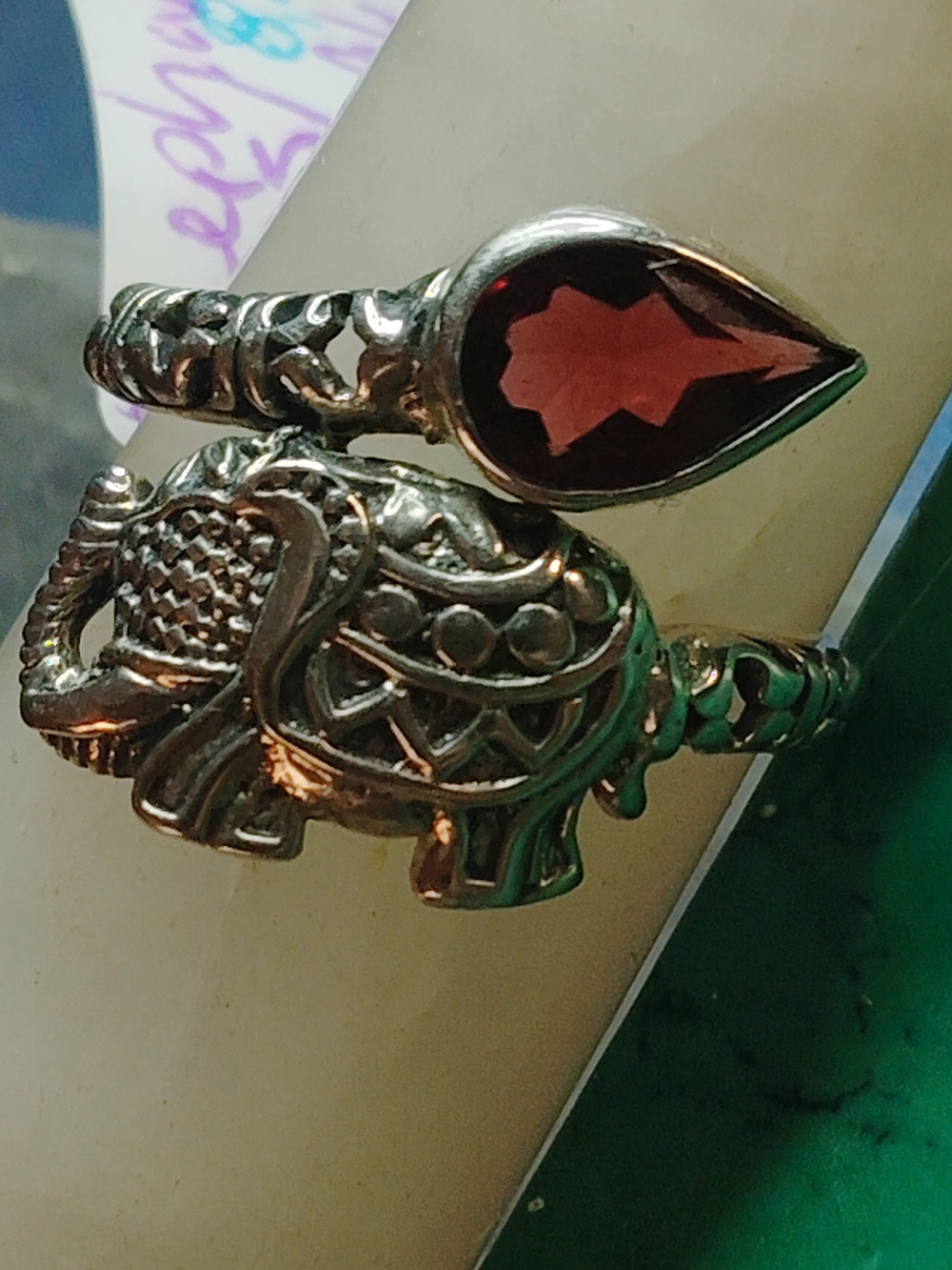 ELEPHANT RING SET WITH MOZAMBIQUE GARNET TEARDROP STONE.  STERLING SILVER. SZ- 7